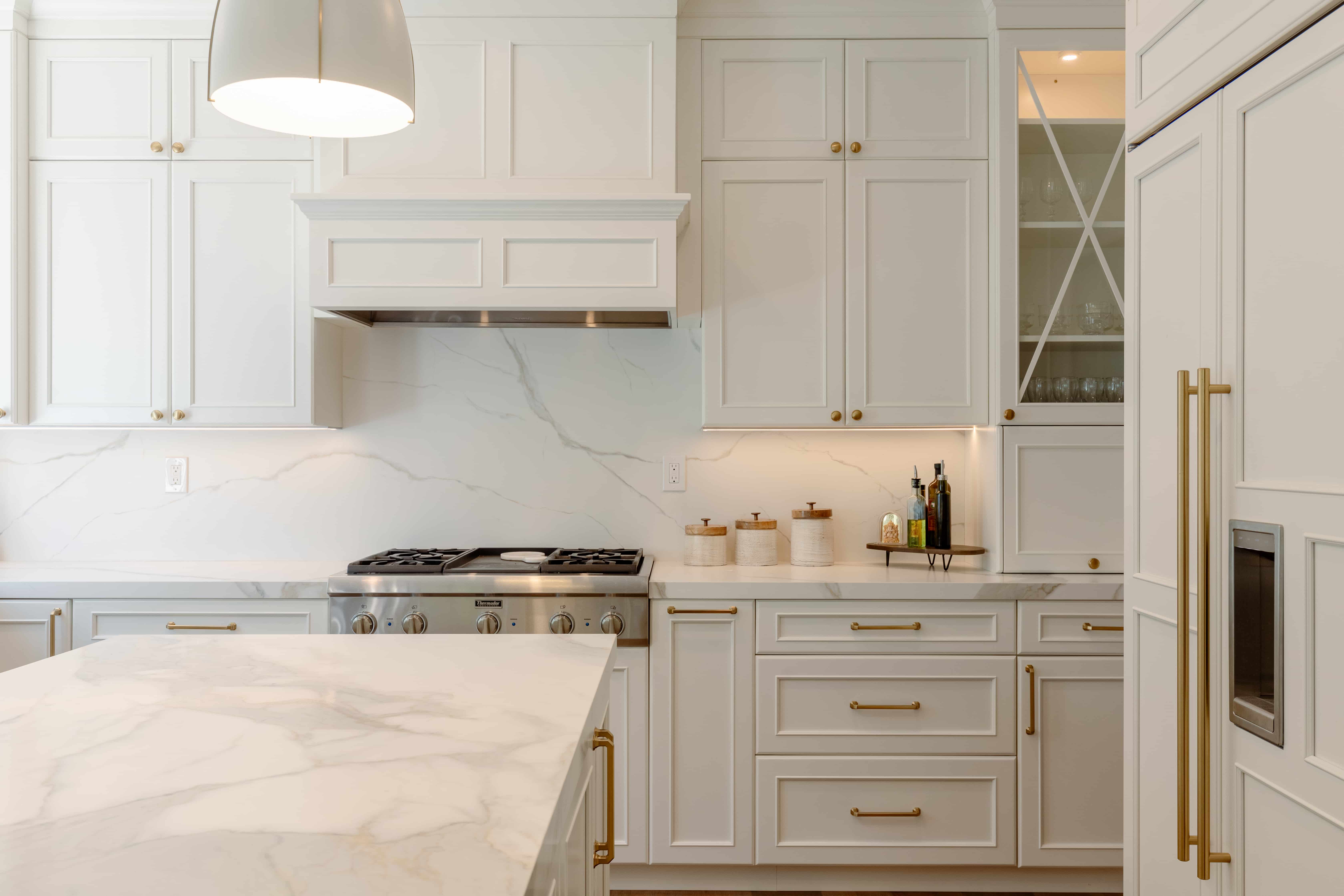 Marble waterfall kitchen island from a NuHome remodel