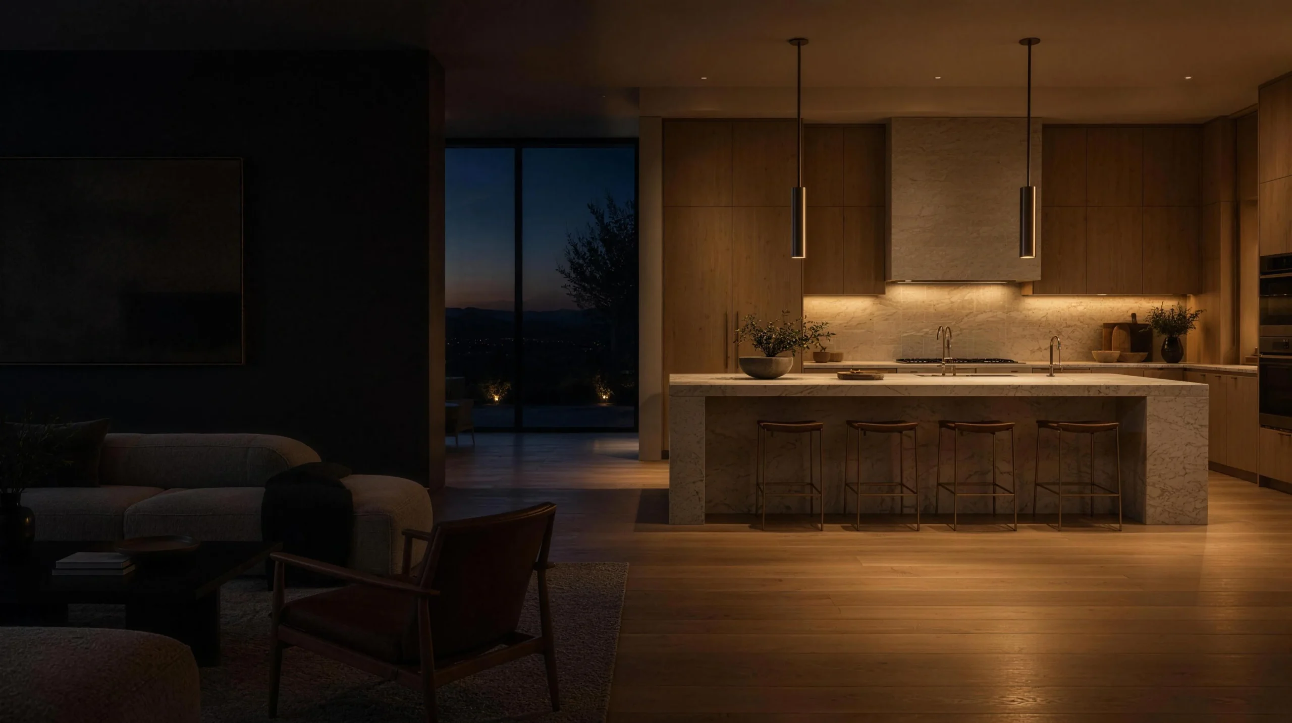 Kitchen remodel at dusk with warm under-cabinet light and bronze pendants
