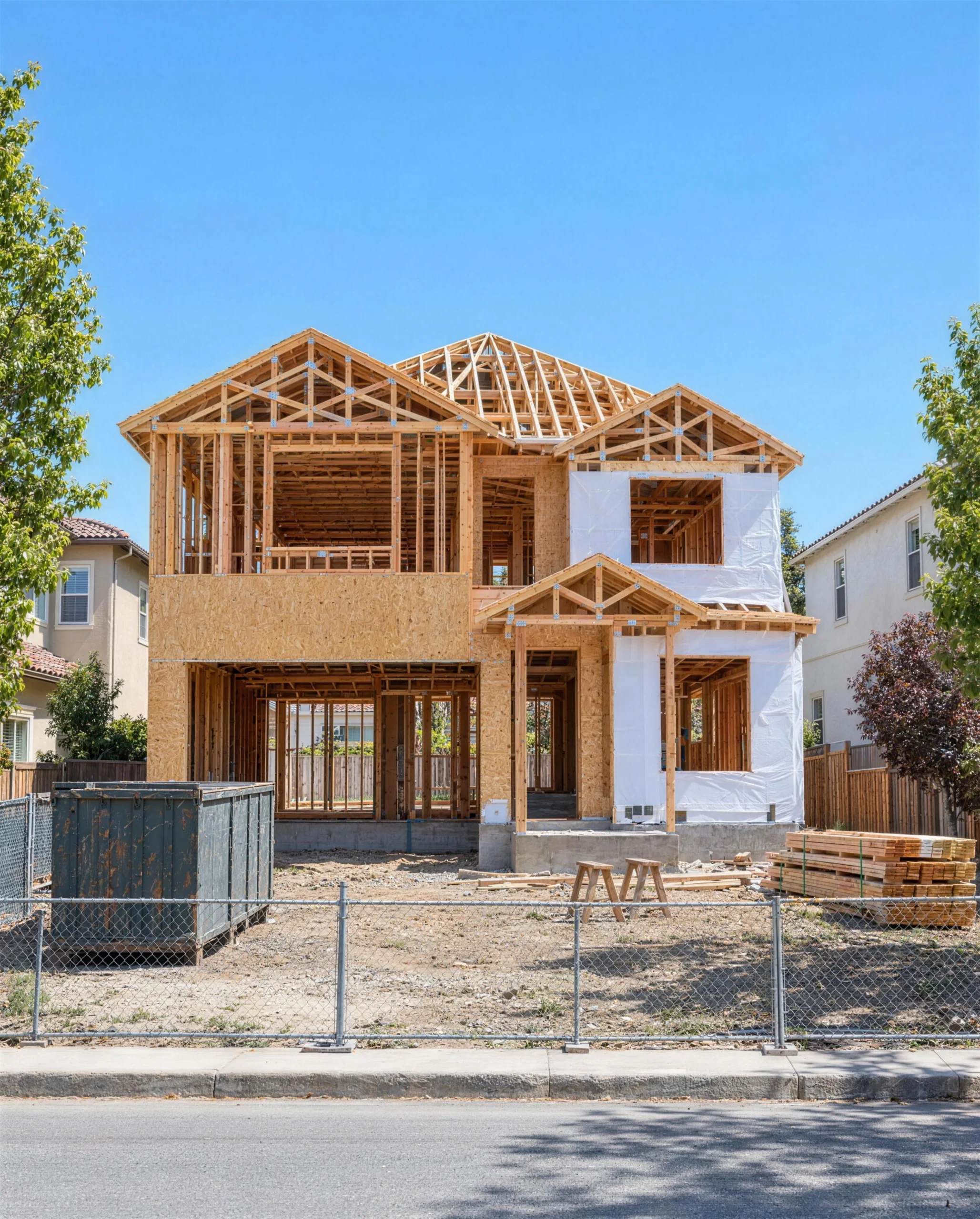 A new two-story custom home in San Jose during the wood framing stage